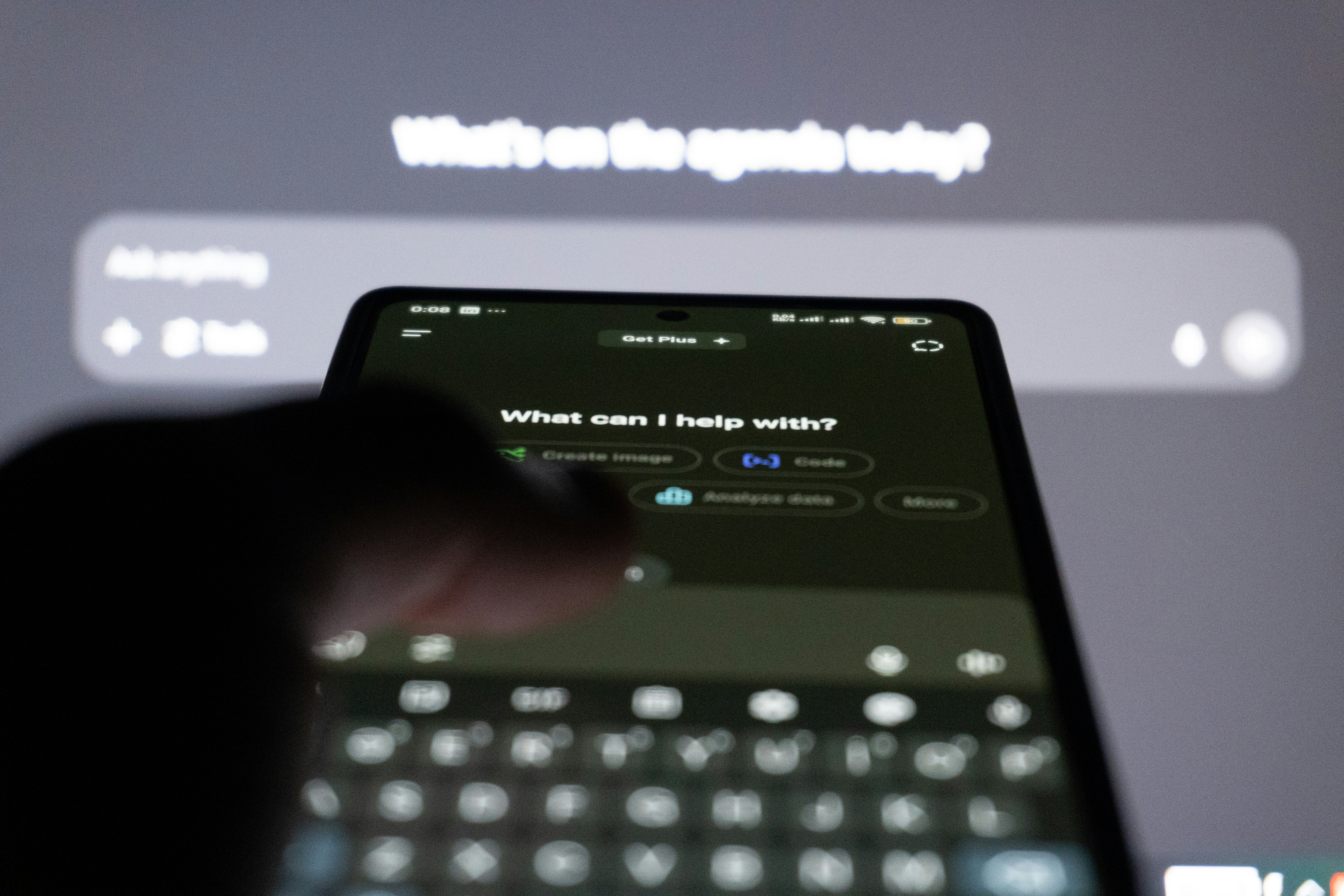 Smartphone screen showing an AI interface with the prompt 'What can I help with?'